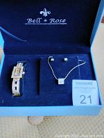 Full set inside navy blue Bell & Rose gift box including watch, necklace, and earrings
