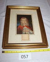 Framed color print of Little Red Riding Hood by George Baxter, gold frame with ornate edge, matting and visible print with embossed mark below image.