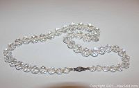 Full view of the clear graduated crystal bead necklace laid flat to show length and bead details.
