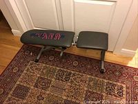 Side view of AB King Pro workout bench showing steel frame and vinyl padding