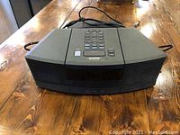 Front view of Bose Wave Radio and CD Player showing front speakers and control panel.