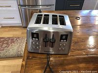 Front view of the Cuisinart 4-slice toaster showing digital display and multiple buttons.