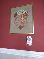 Framed heraldry coat of arms wall art with shield and crest in blue, red and gold colors