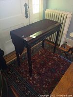 Front view of carved table with runner in place