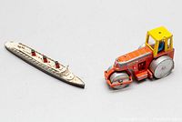 Both the Dinky Toys Cunard White Star Ship and Aveling Barford Diesel Roller tractor shown together from top-side angle.