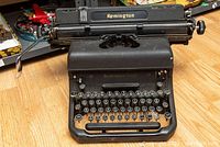 Front view of typewriter showing keyboard and brand markings
