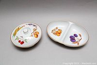 Photo of lidded bowl and sectional oval bowl with Evesham pattern and gold trim