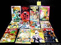Box containing an assortment of various comic books including She-Hulk, Maxx, Live It Up, Silver Surfer, and others displayed to show condition and variety.