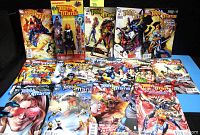 Collection of 13 Teen Titans comic books with colorful character covers and the Blackfire figure in packaging behind