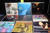 Photo showing nine assorted vinyl record albums with classical, pop, and symphony orchestra themed cover art.