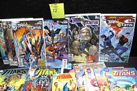 Photo shows a collection of Teen Titans comic books including The New Titans issues from 1993 and Teen Titans issues from 2006-2007 series. Comics are bagged and boarded, displayed horizontally against a black background.