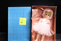 Blue original Madame Alexander outer box with logo pattern and lot number sticker.