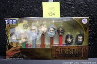 Front image of boxed set containing eight PEZ dispensers with character heads from The Hobbit movie series.