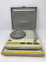 Full view of vintage Panasonic record player with lid open showing turntable and controls.