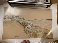 Full view of the ocean landscape print showing shoreline, water, and distant mountains.