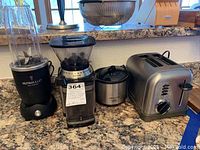 Front view of the lot on kitchen counter showing all four items
