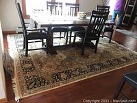 Full view of carpet laid under dining table in room