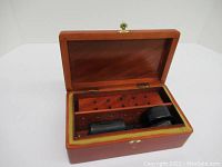 Opened humidor showing interior and accessories inside