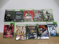 Front view of all 10 Xbox 360 game cases showing cover art.
