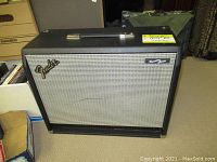 Full front view of the Fender dual speaker extension cabinet showing black tolex and silver grille cloth.