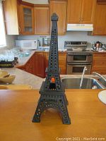 Full frontal view of the cast iron Eiffel Tower figurine displaying structure and shape