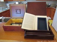 Photo showing the open vintage wooden cigar box alongside the open hidden box book and a wooden box with recessed circular design lid