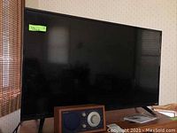 Vizio 39 inch flat screen TV with two angled legs for support.