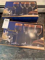 Boxes of Baroque water goblets showing packaging with blue box and floral design
