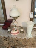 Full lot display of hobnail milk glass lamp, vase, two candlesticks, wooden jewelry box and Capodimonte porcelain trinket box.