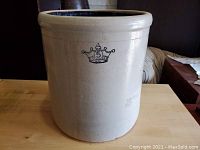 Front view of the 5 gallon Ransbottom Brothers antique picking crock showing the crown and number 5 emblem on its white stoneware body.