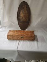 Rectangular wooden box with pyrography floral design on lid and sides, with hinged lid, hinges loose.