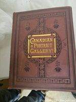 Front cover of one volume showing brown cloth with gilt title 'Canadian Portrait Gallery' and decorative border.