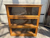 Front view of three-tier barrister bookcase showing all three glass-front compartments