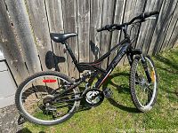 Full right side view of the Next mountain bike showing the frame, rear suspension, and drivetrain.