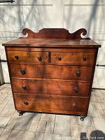 Full front view showing overall form, drawer layout and caster feet