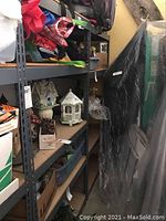 Two grey metal storage shelves with wooden shelf panels, measuring roughly 36x18 inches wide and 72 inches tall, shown assembled with various items on shelves (contents not included).