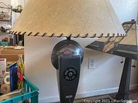 View of entire lamp showing fabric lampshade atop vintage parking meter body with coin slot and time expired dial visible.