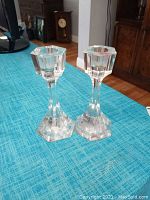 Pair of clear Atlantis crystal candle sticks with hexagonal bases and top sections