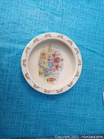Antique Royal Doulton feeding dish showing rabbit border and central nursery rhyme scene