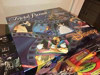 Disney Trivial Pursuit board game box featuring various Disney characters