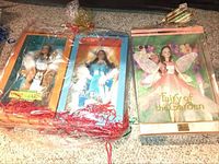 Three Barbie collectible dolls in original boxes: Spirit of Earth, Spirit of Water, Fairy of the Garden. Dolls appear new and sealed in packaging.