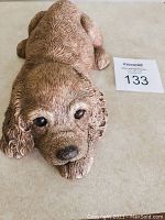 Top angle view showing detailed textured fur and facial features of the Cocker Spaniel figurine.