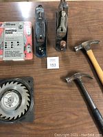 Two wooden-handled hammers, two metal hand planes, Craftsman triple-cutter molding head set in packaging, Craftsman adjustable dado saw blade with guard