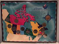 Photo of the sealed collector's set displaying a color-coded map of Canada with attached commemorative coins for each province and territory, pre-Nunavut, with an informative blurb about the collection.