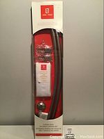 Full packaged view of the curved shower rod, curtain and mounting hardware inside the unopened box.