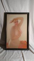 Framed oil painting of a nude woman against a light background, full view showing entire painting and frame.