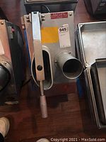 View of Fleetwood slicing machine showing lever handle and feeding chute