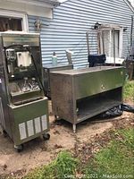Both Taylor machine and stainless steel sink station outdoors