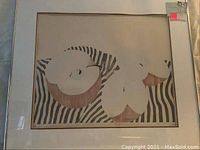 Full view of the framed lithograph titled "One Gravenstein" showing apples on zebra patterned cloth, with visible matting and frame.