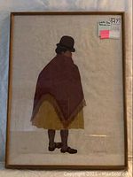 Framed silk screen artwork of a Bolivian woman in bowler hat and poncho shown full front view.